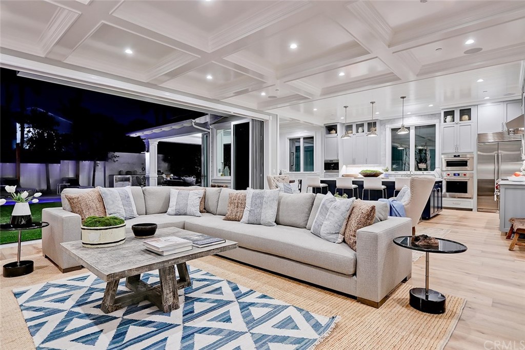 1751 8th Street Manhattan Beach, CA 90266 - Photo 4 of 43 a living room with furniture kitchen view and a large window
