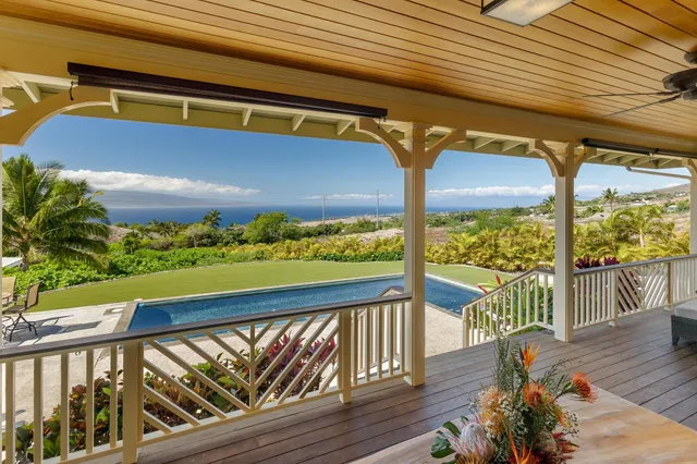 a view of balcony with wooden floor
