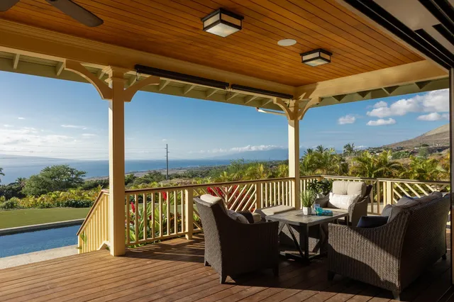 a view of a balcony with furniture