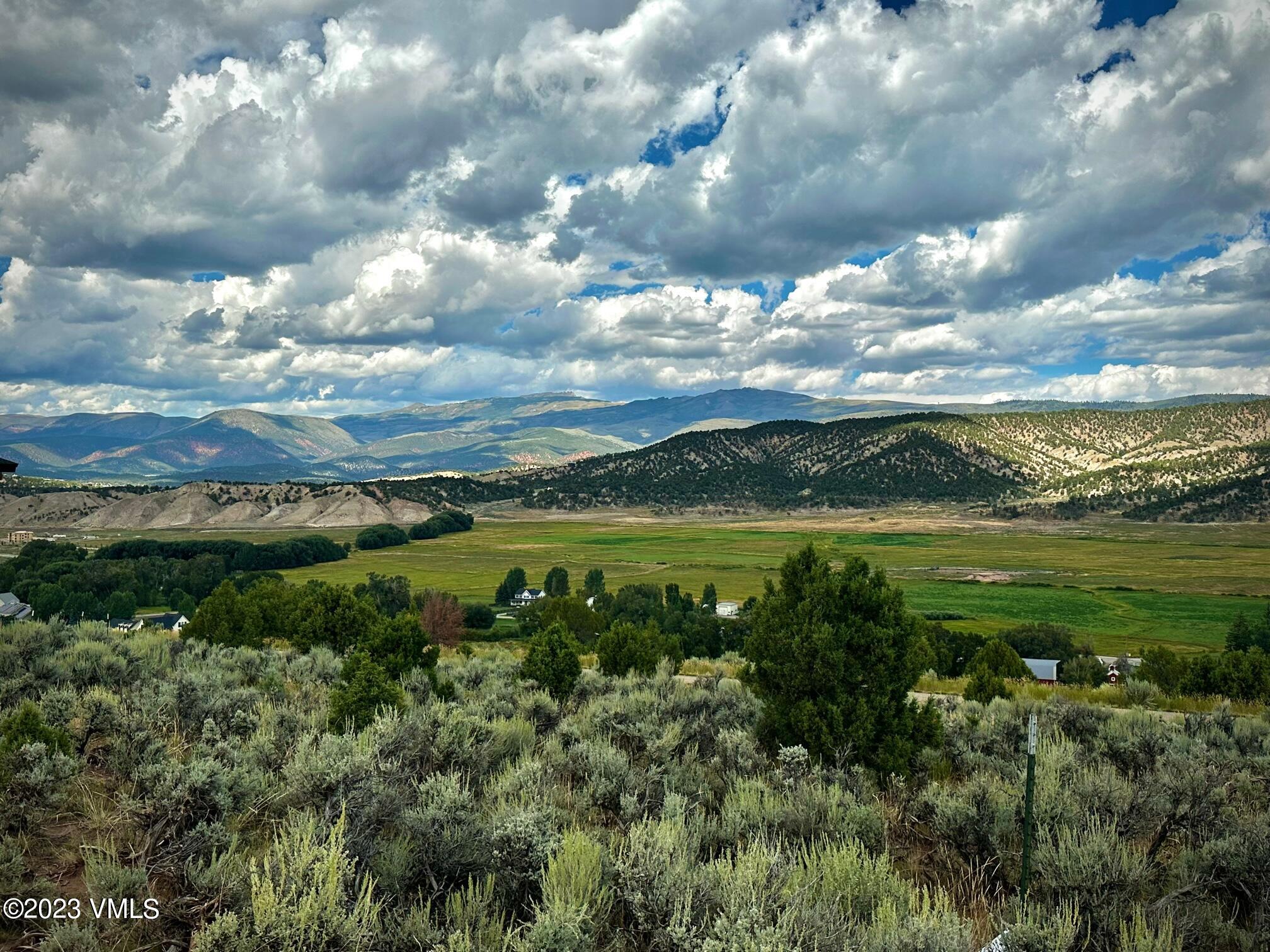 1069 East Haystacker Drive Eagle, CO 81631 - Photo 1 of 3 a view of a lake with a city