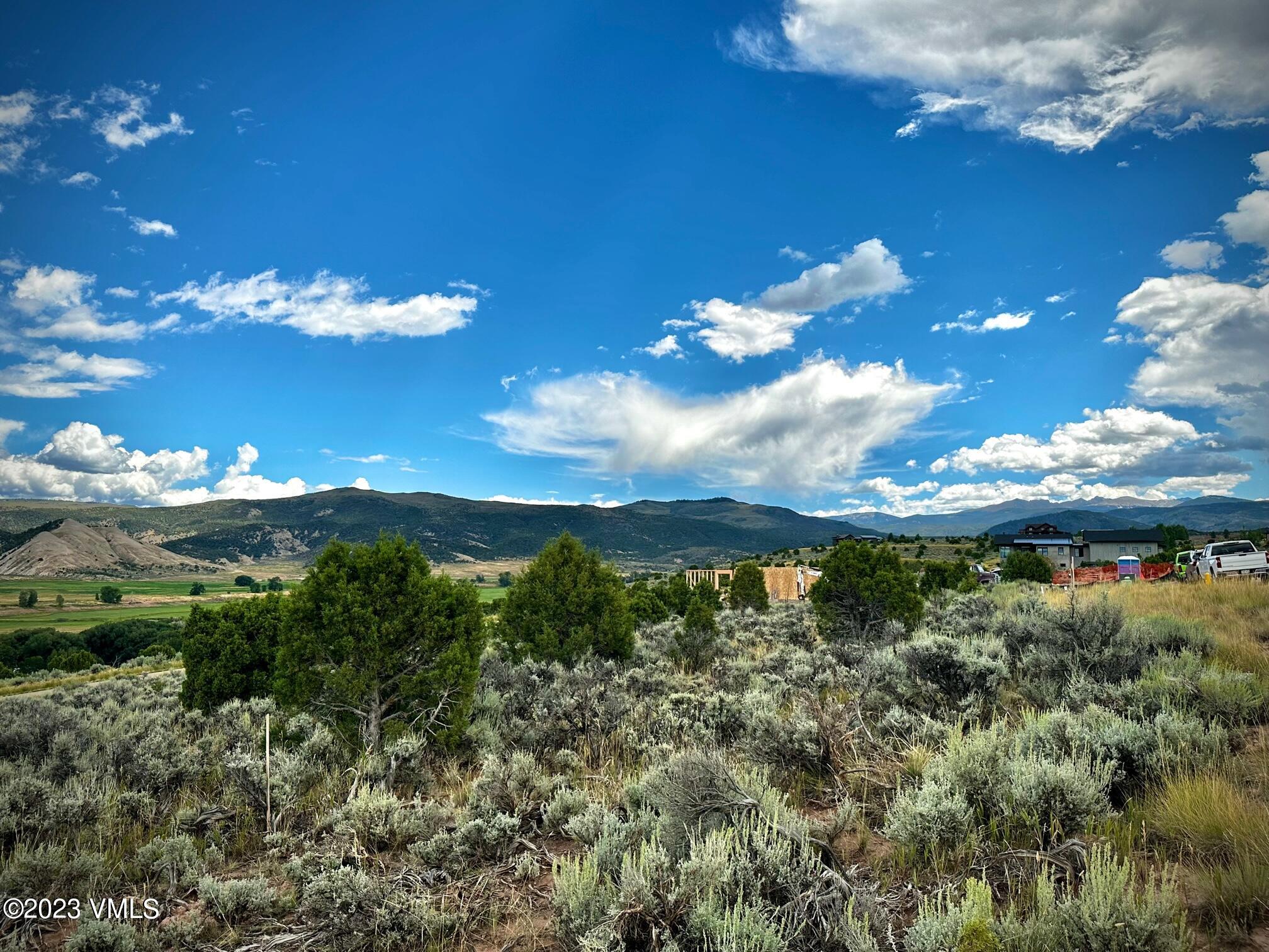 1069 East Haystacker Drive Eagle, CO 81631 - Photo 2 of 3 a view of a lake with lots of green space