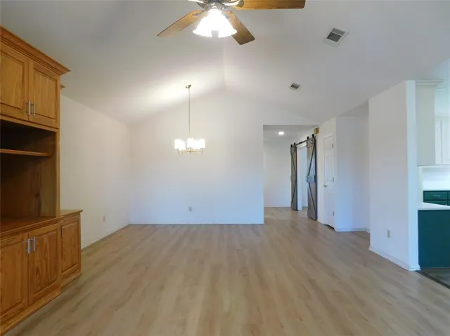 a view of an empty room with a fireplace