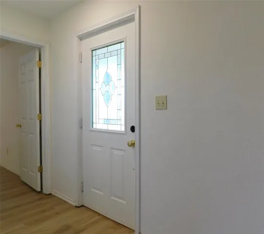 a view of a bathroom with wooden floor