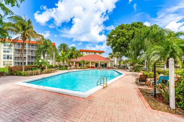 a view of a swimming pool with a patio