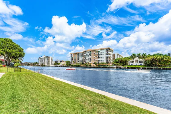 a view of swimming pool is middle in the garden