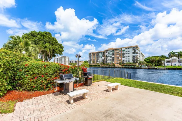 a view of a swimming pool with a lounge chairs