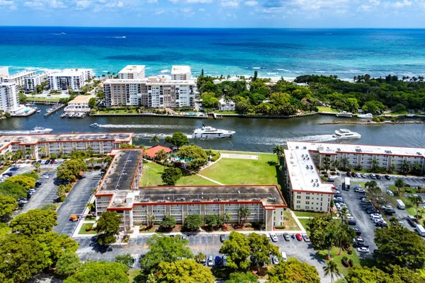 a view of a lake with a table and a chairs