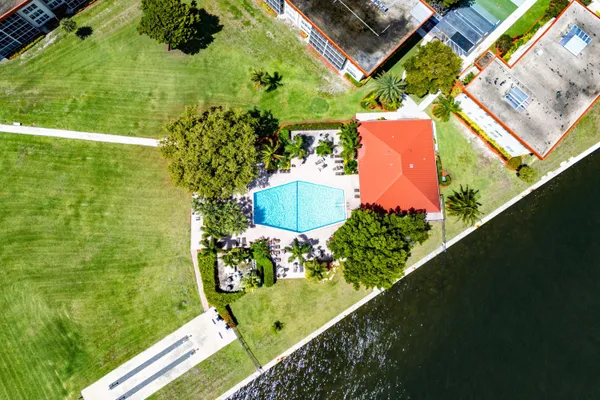 a view of a cars park in front of a building