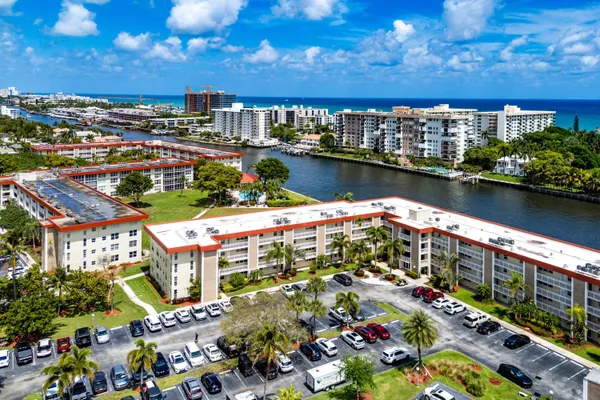 an aerial view of residential houses with outdoor space