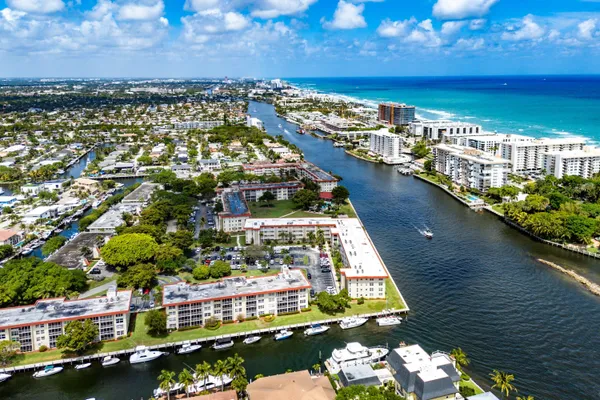 an aerial view of a house with a lake view
