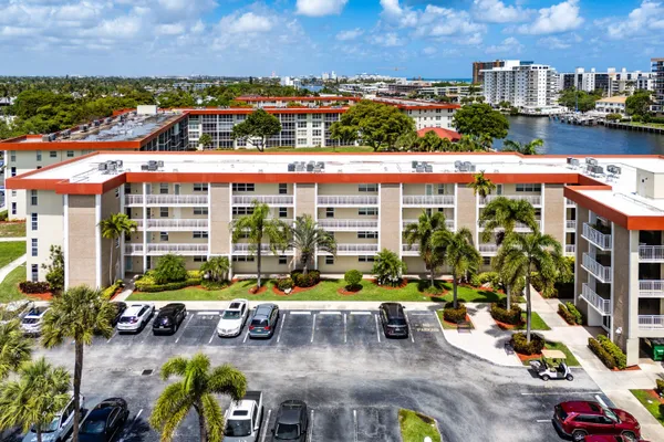a view of a porch with a table and chairs