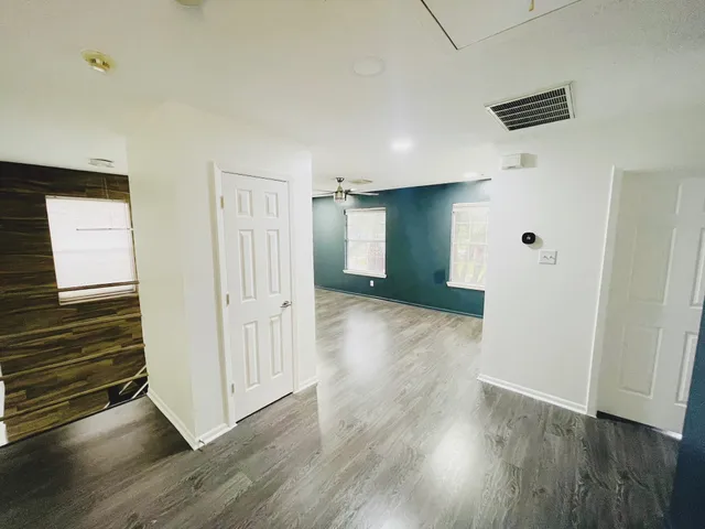 a view of a livingroom with wooden floor