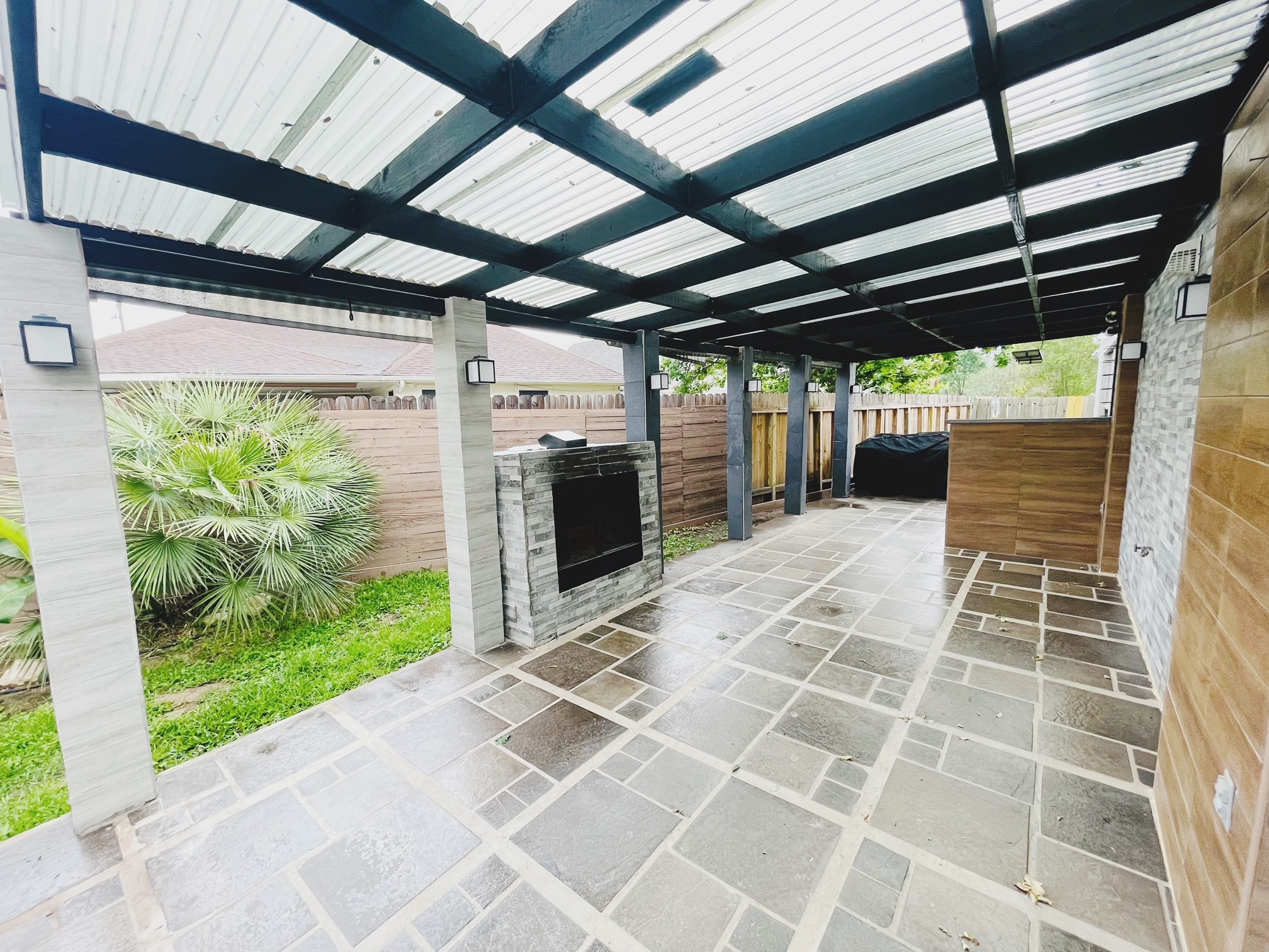 19639 River Bottom Road Katy, TX 77449 - Photo 31 of 36 a view of a porch with wooden floor and iron stairs