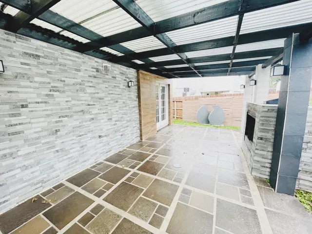 a view of an empty room with a glass door