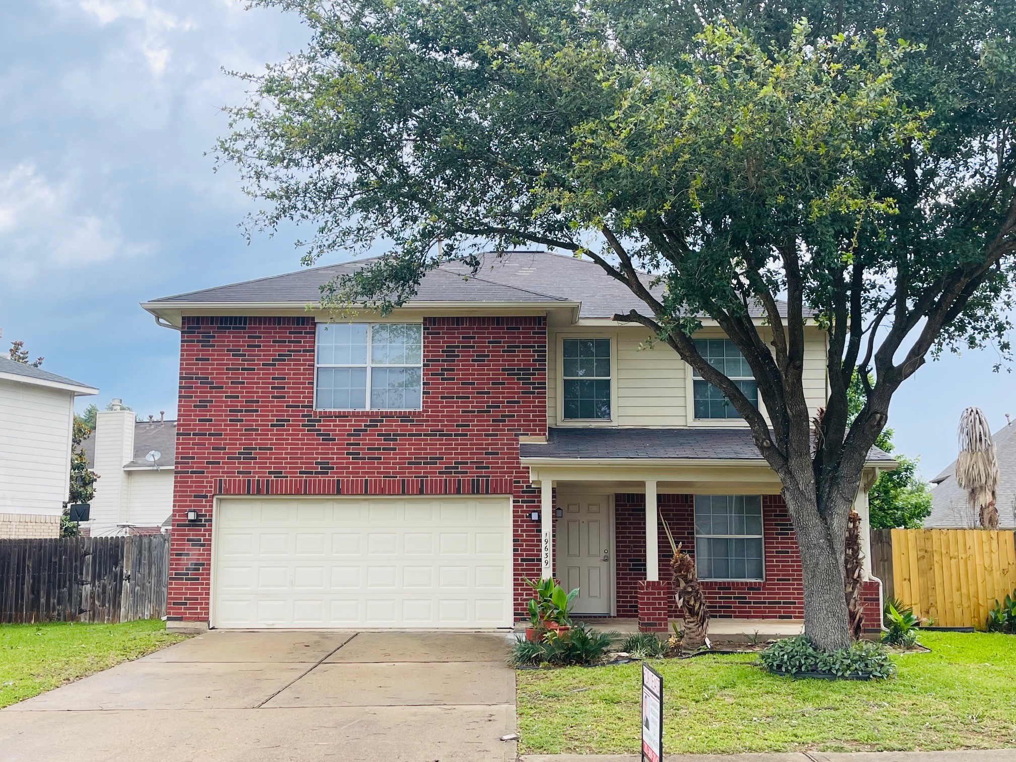 19639 River Bottom Road Katy, TX 77449 - Photo 35 of 36 a front view of a house with garden