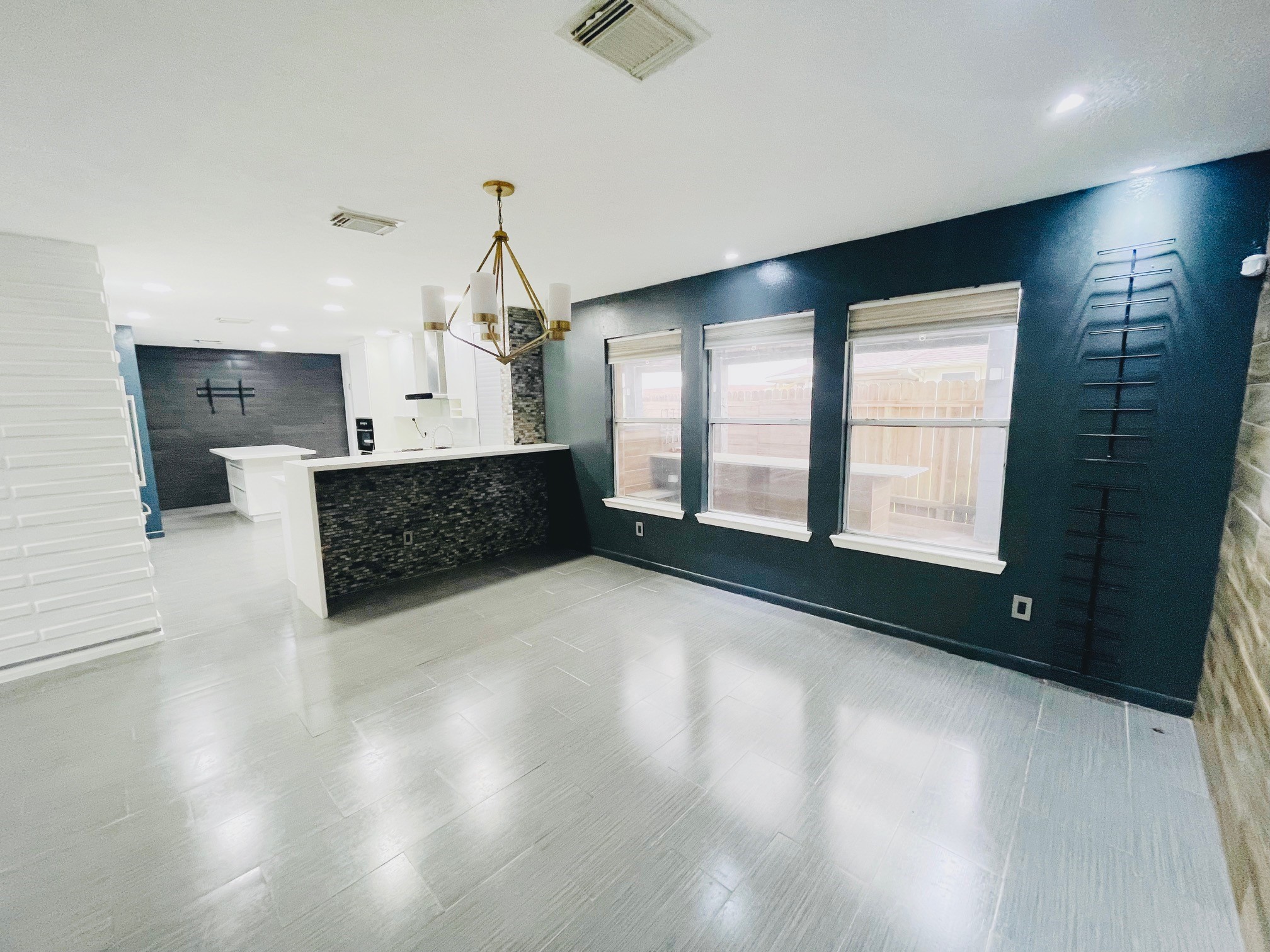 19639 River Bottom Road Katy, TX 77449 - Photo 4 of 36 a living room with hard wood floors and a kitchen space