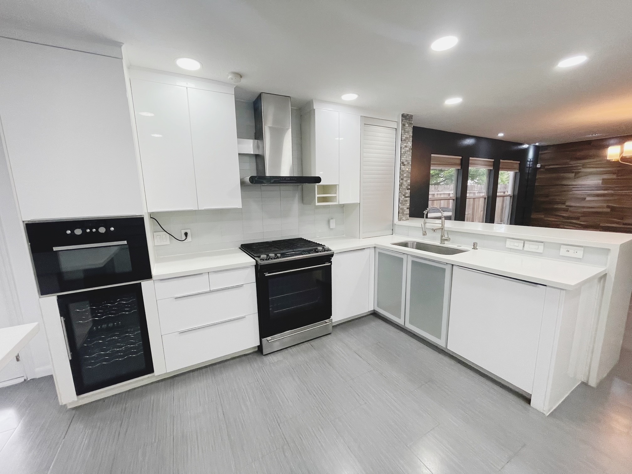 19639 River Bottom Road Katy, TX 77449 - Photo 6 of 36 a kitchen with granite countertop a stove top oven and cabinets