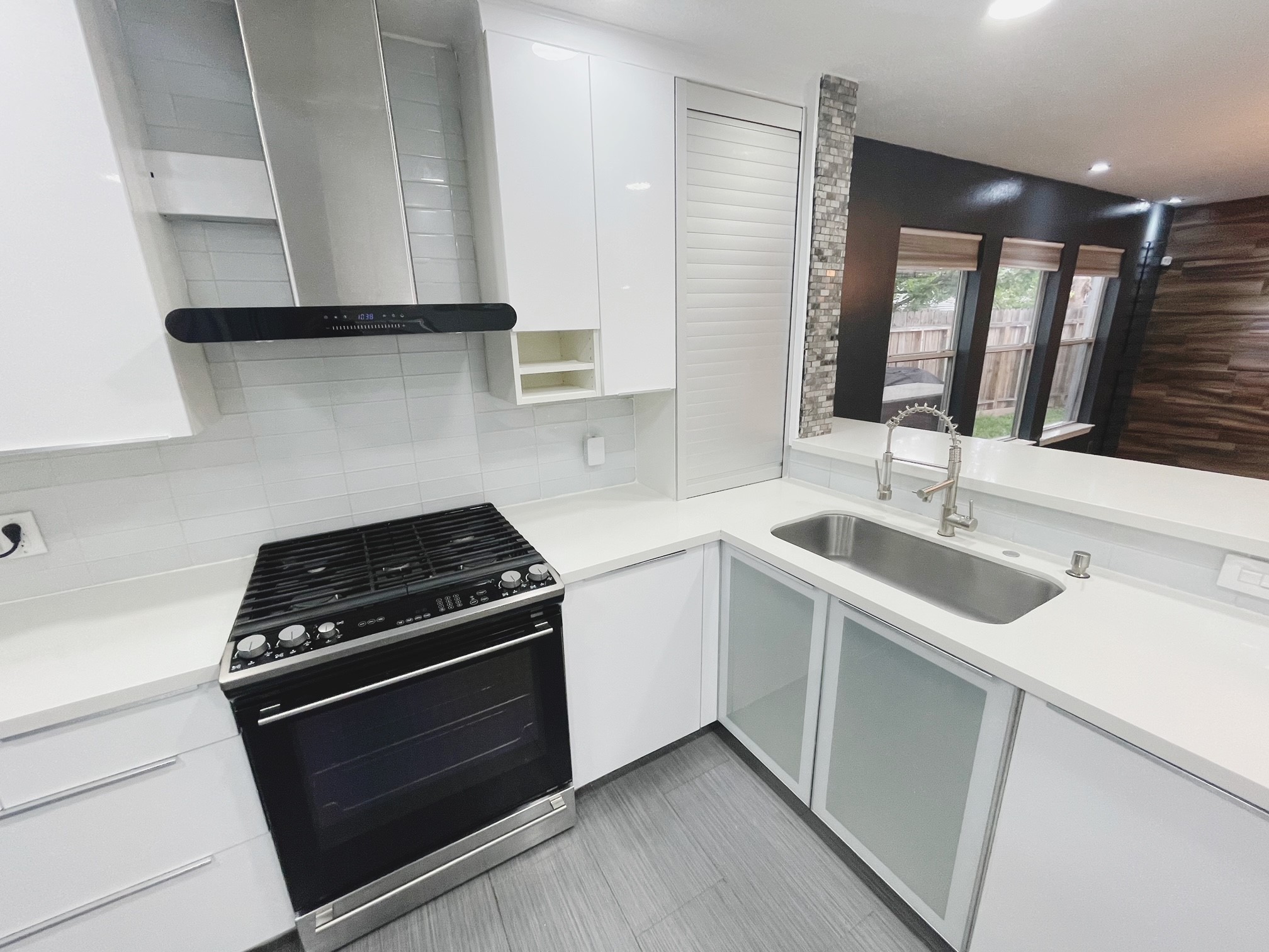 19639 River Bottom Road Katy, TX 77449 - Photo 7 of 36 a kitchen with granite countertop white cabinets stainless steel appliances and sink