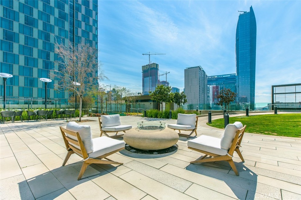 889 Francisco Street, Unit 3702 Los Angeles, CA 90017 - Photo 20 of 22 a swimming pool with outdoor seating and yard