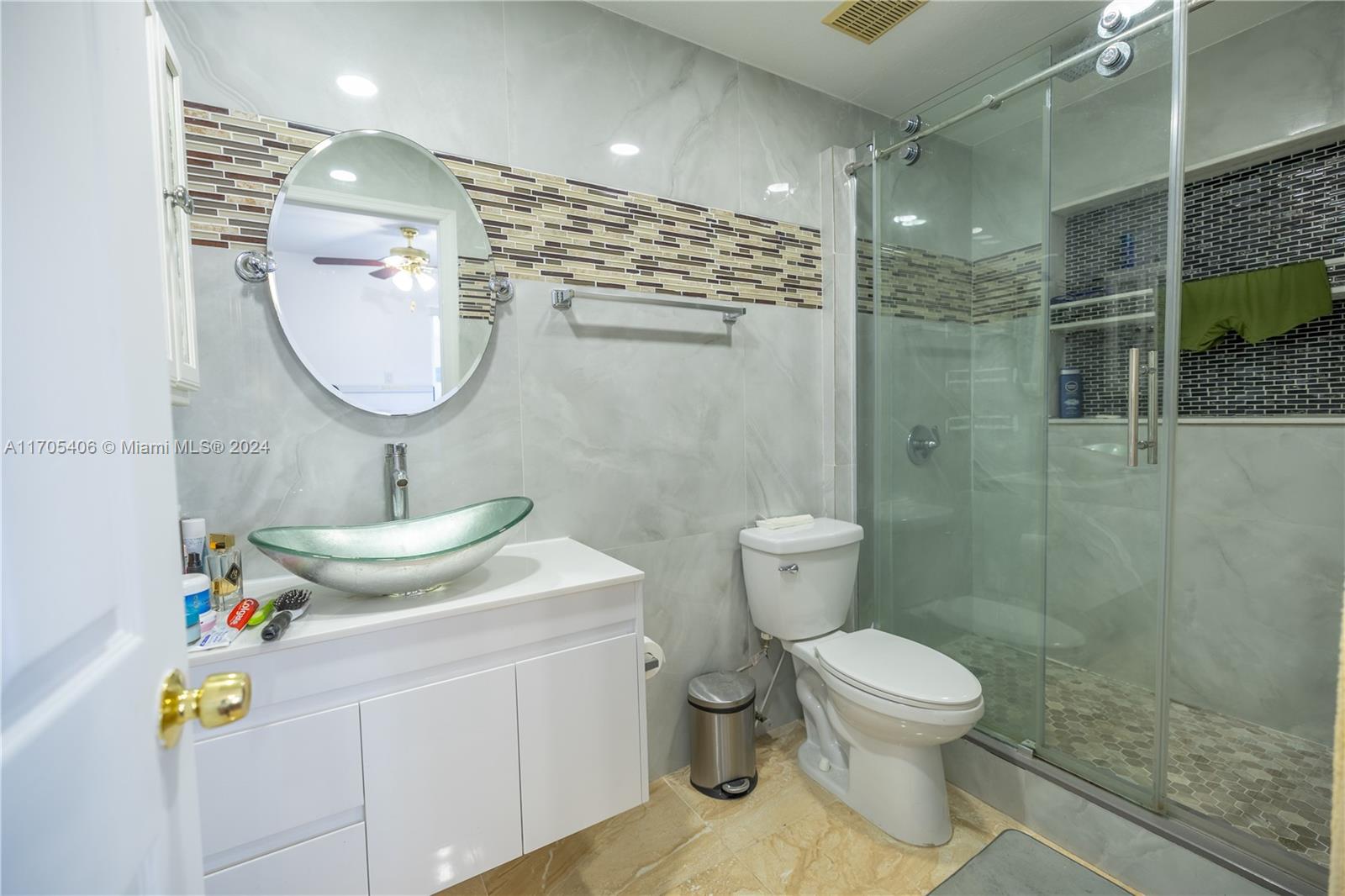 24622 Southwest 112th Court Homestead, FL 33032 - Photo 15 of 22 a bathroom with a sink toilet and shower