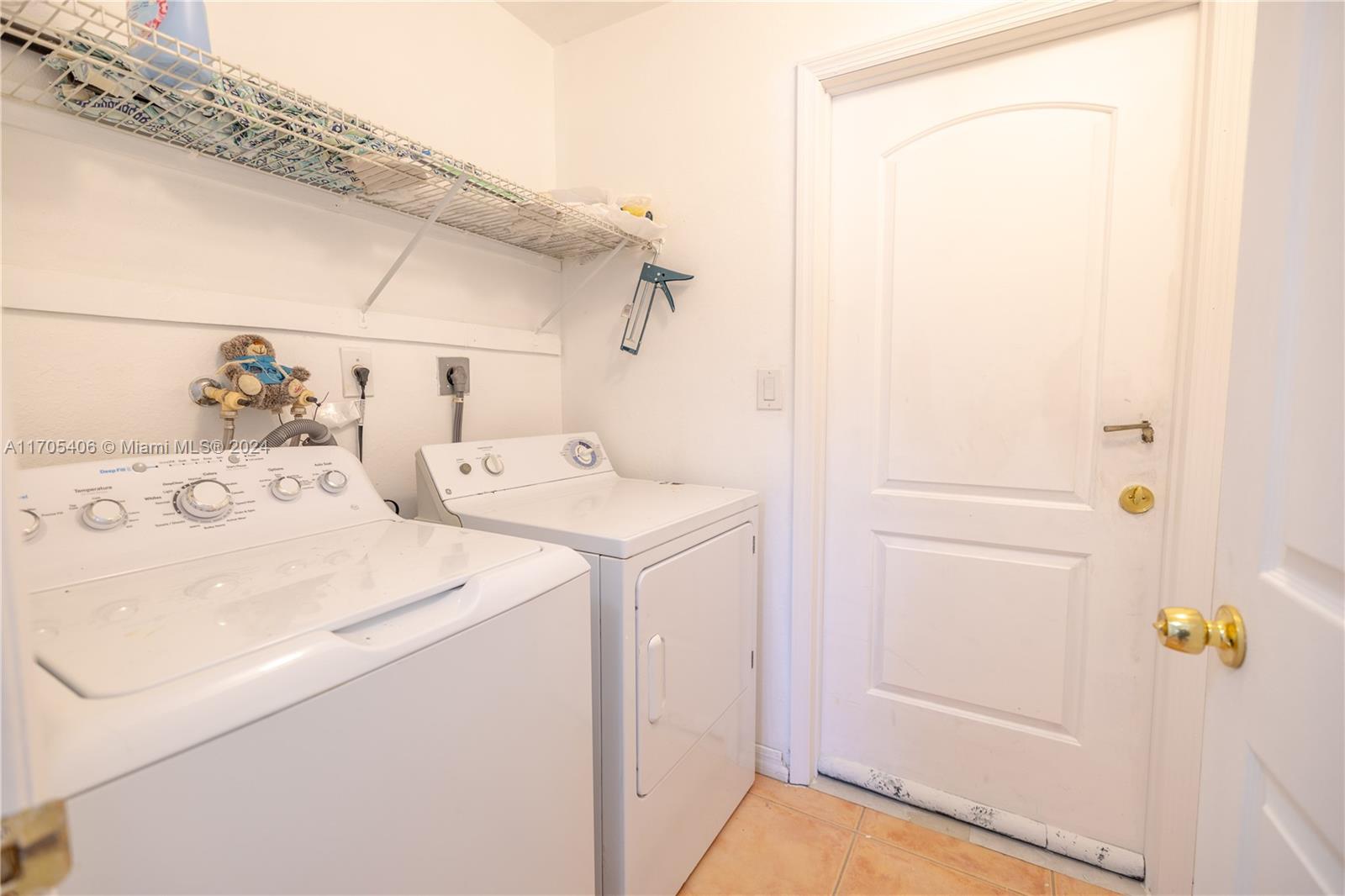 24622 Southwest 112th Court Homestead, FL 33032 - Photo 16 of 22 a utility room with dryer and washer