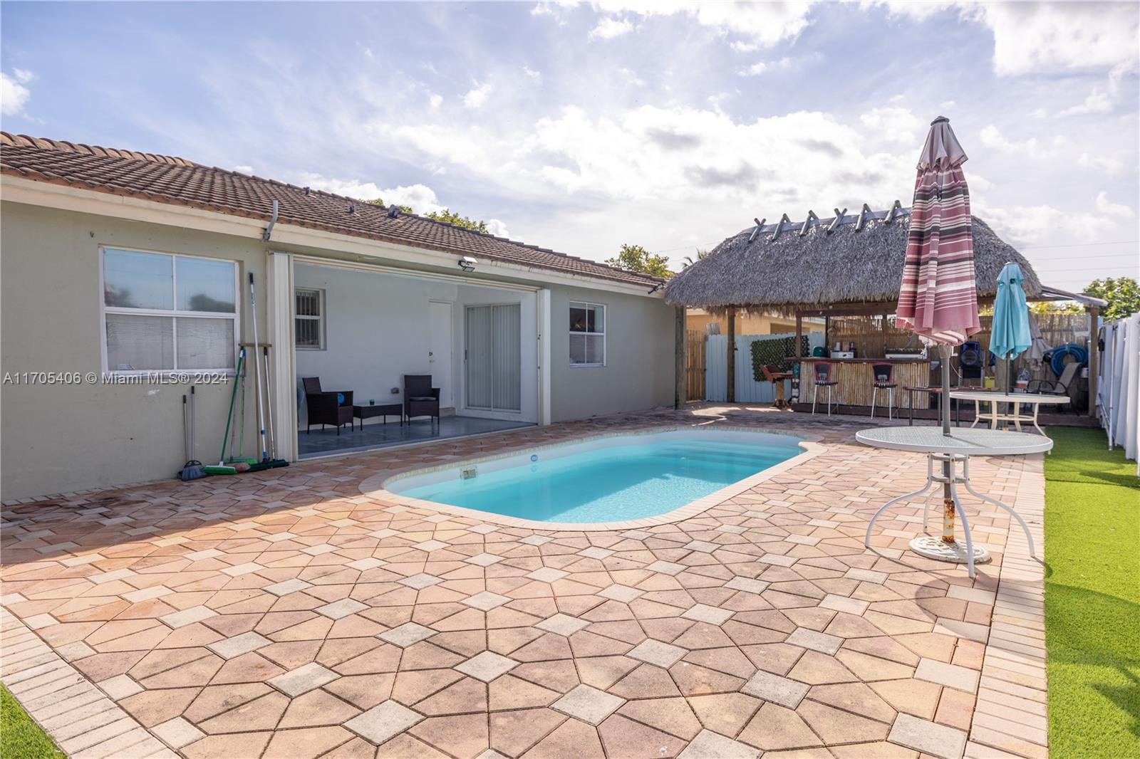 24622 Southwest 112th Court Homestead, FL 33032 - Photo 20 of 22 a view of a swimming pool with a patio