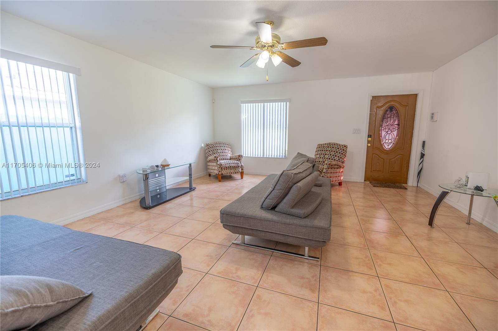 24622 Southwest 112th Court Homestead, FL 33032 - Photo 4 of 22 a living room with furniture