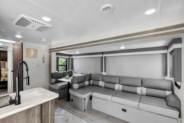 a kitchen with stainless steel appliances granite countertop a stove sink and cabinets