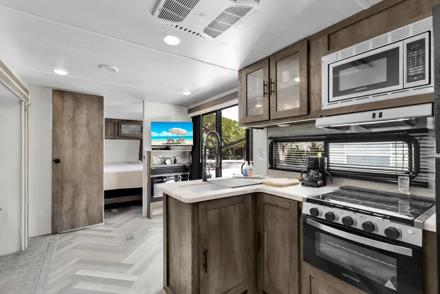 a living room with a sink furniture and a table