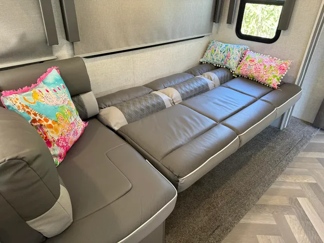 a living room with furniture and a table