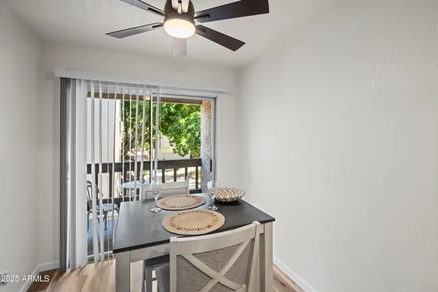 a dining room with furniture and window