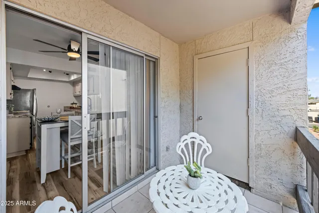 a view of a hallway with furniture