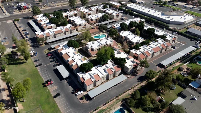 a view of a house with backyard and a tree