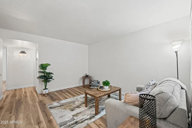 a bedroom with a bed and a potted plant