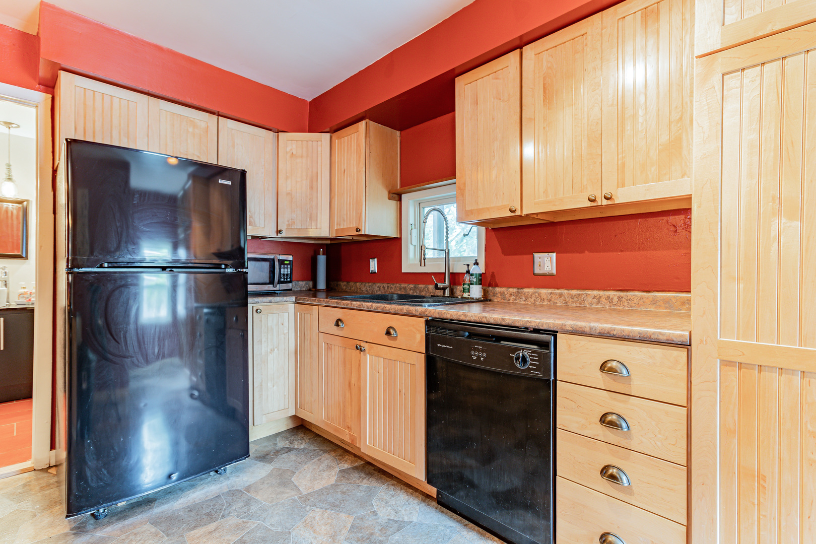 506 South Webber Street Urbana, IL 61801 - Photo 12 of 27 a kitchen with stainless steel appliances granite countertop a refrigerator and a sink