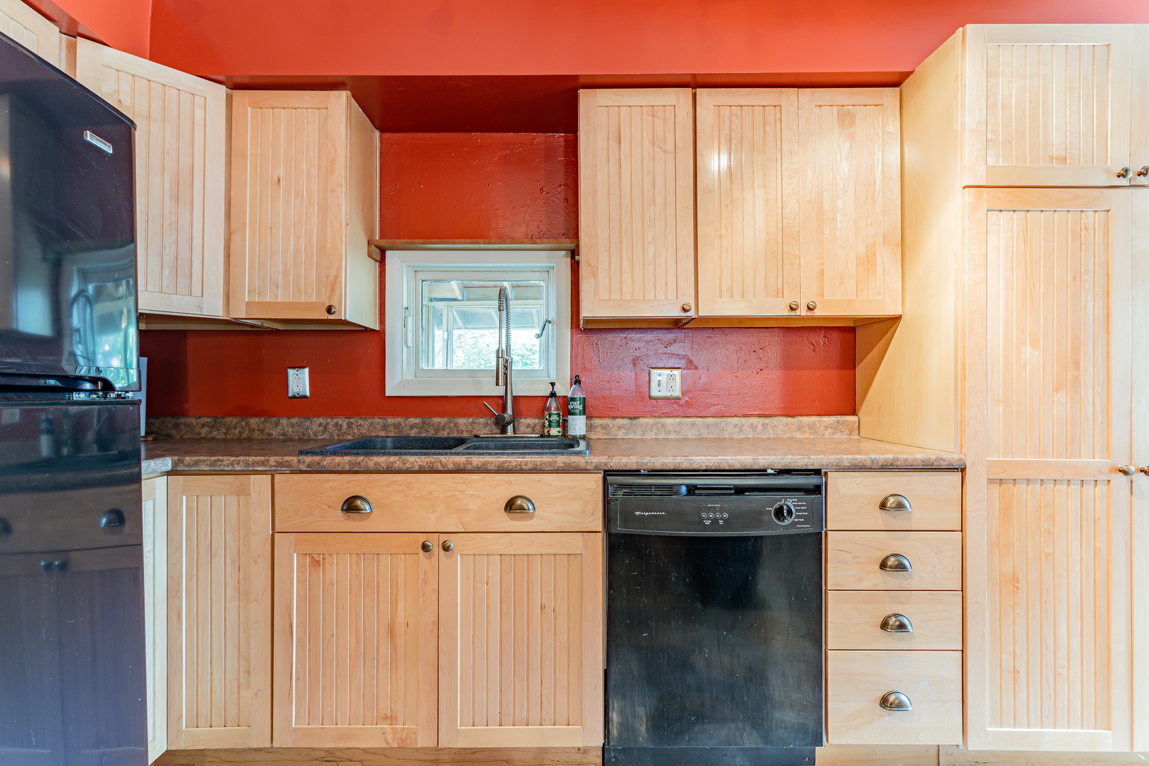 506 South Webber Street Urbana, IL 61801 - Photo 13 of 27 a kitchen with granite countertop a sink a stove and cabinets