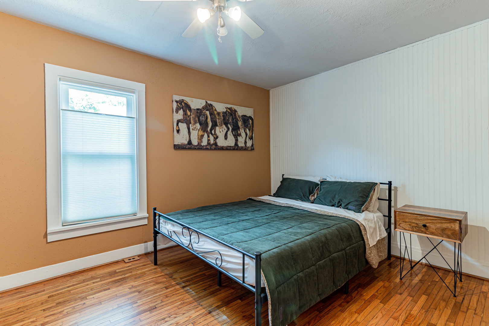 506 South Webber Street Urbana, IL 61801 - Photo 15 of 27 a bedroom with a bed and wooden floor