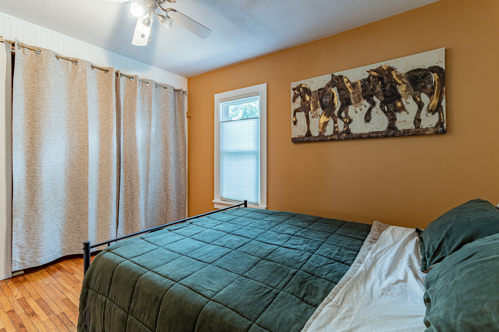 506 South Webber Street Urbana, IL 61801 - Photo 16 of 27 a bedroom with a bed and a painting on the wall