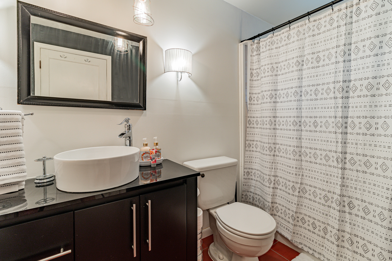 506 South Webber Street Urbana, IL 61801 - Photo 18 of 27 a bathroom with a toilet a sink and a mirror