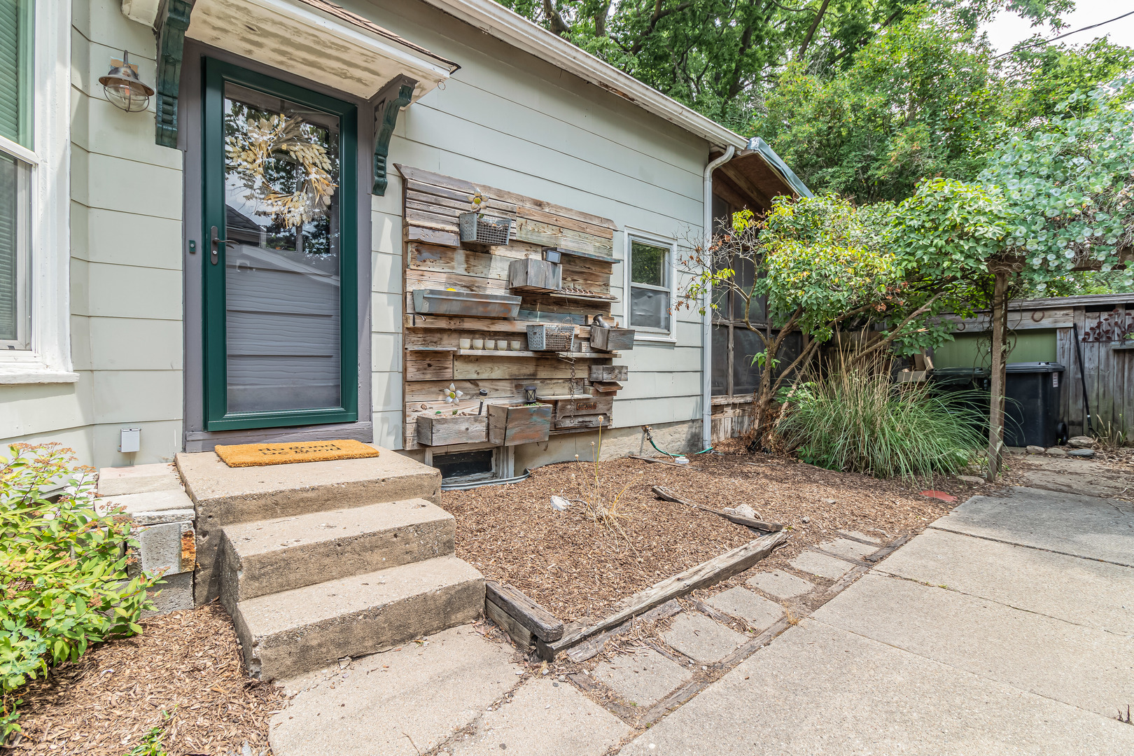 506 South Webber Street Urbana, IL 61801 - Photo 2 of 27 a front view of a house with a garden