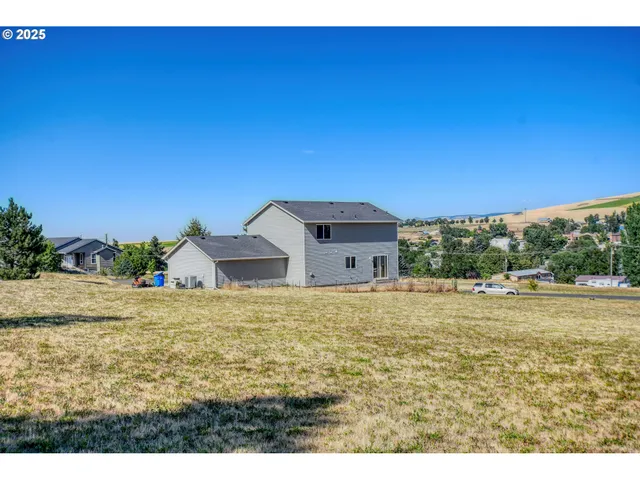 a big room with yard and large trees