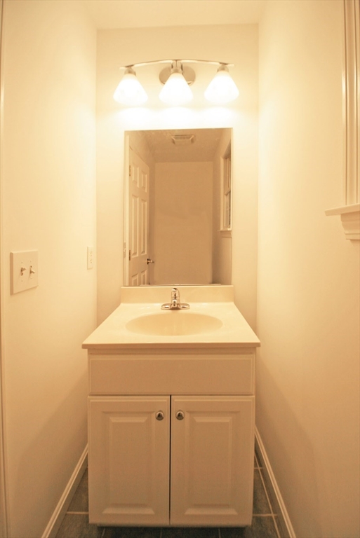 36 Torrey Street Easthampton, MA 01027 - Photo 16 of 20 a bathroom with a sink and a mirror