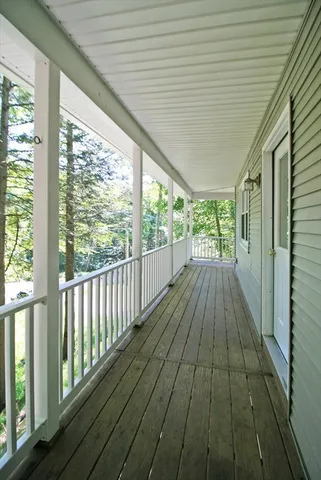 a view of balcony with wooden floor