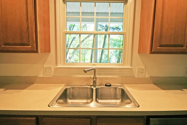 a view of a sink and a window