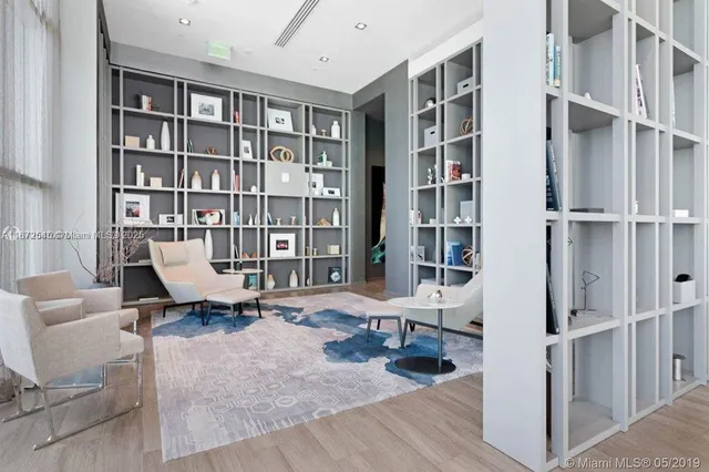 a workspace with furniture and a book shelf
