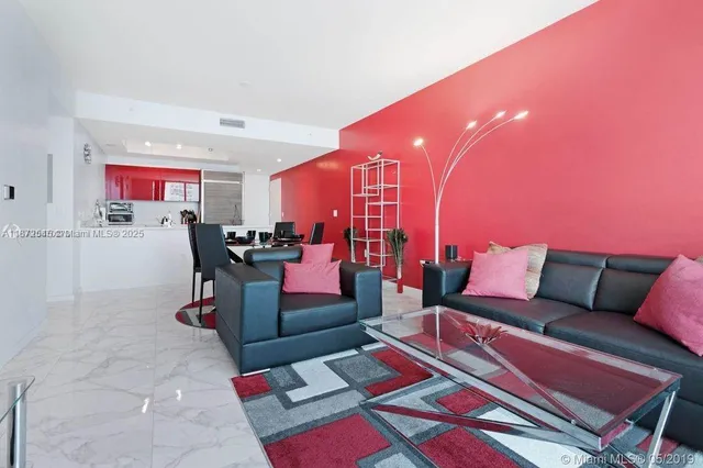 a living room with furniture and a rug