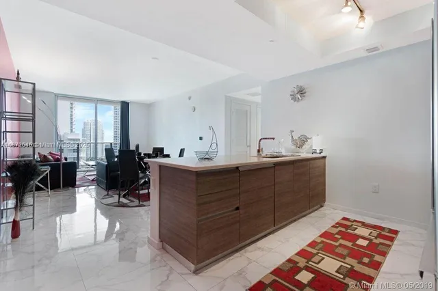 a bed room with a bed and a mirror