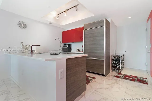 a bathroom with a sink vanity and mirror