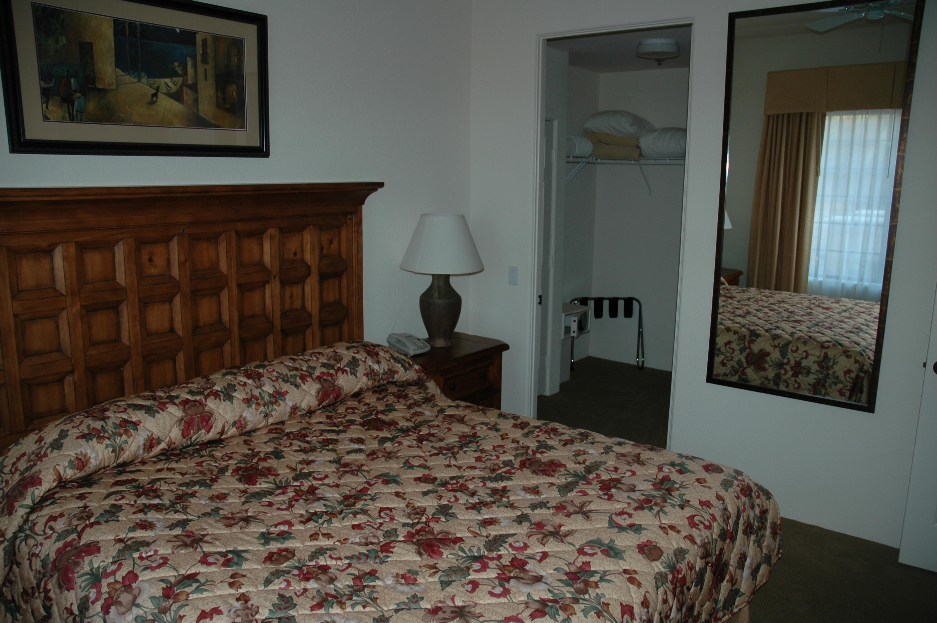 50740 Santa Rosa Plaza, Unit 5 La Quinta, CA 92253 - Photo 11 of 17 a bedroom with a bed and a dresser