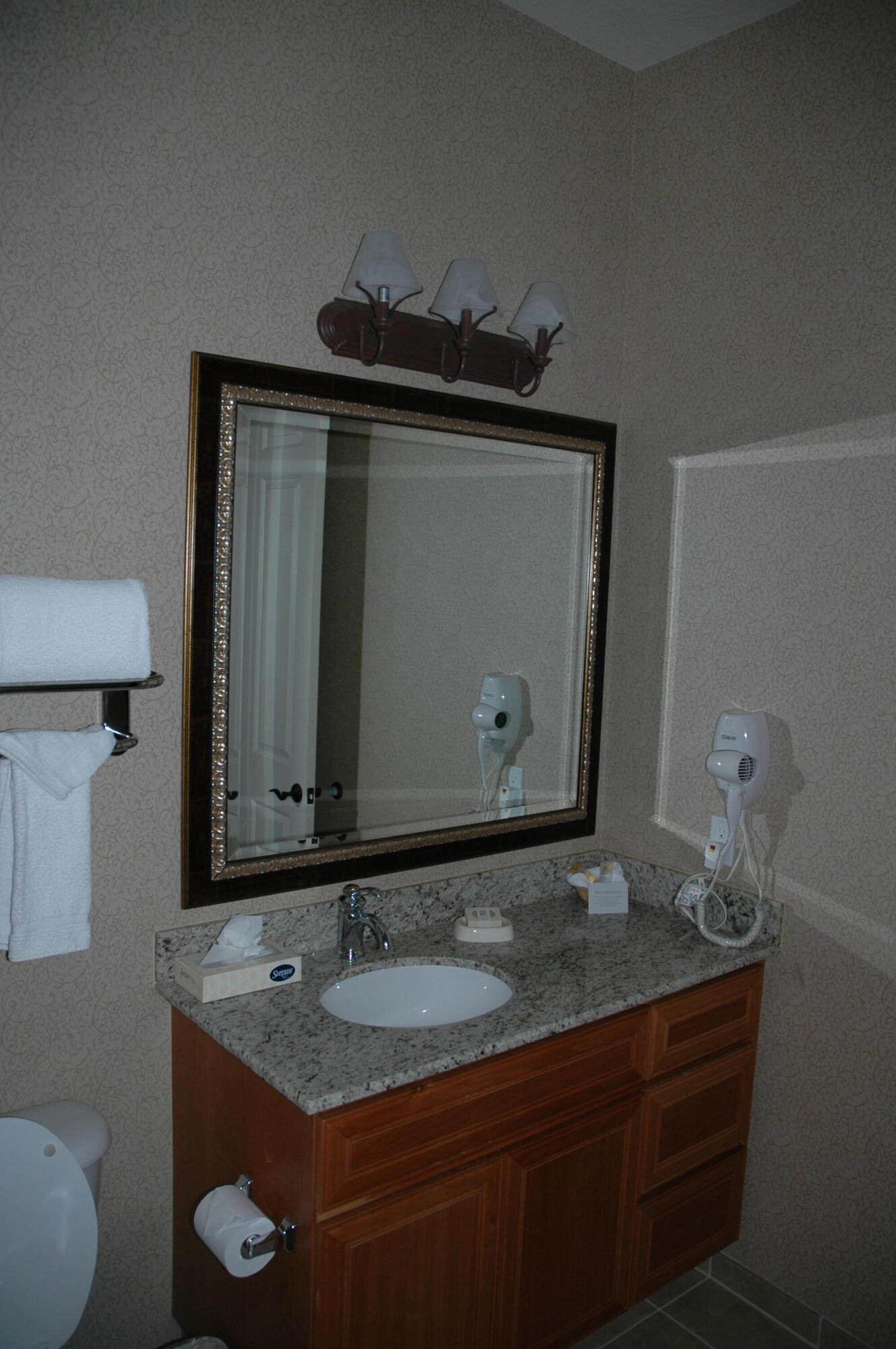50740 Santa Rosa Plaza, Unit 5 La Quinta, CA 92253 - Photo 12 of 17 a bathroom with a granite countertop sink and a mirror